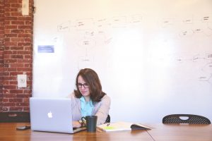 Woman working in office to get sale leads 