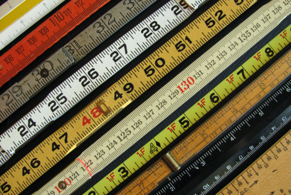 Old rulers both metric and inches, scales and measuring tools represent measurement, metrics, precision, accuracy and results